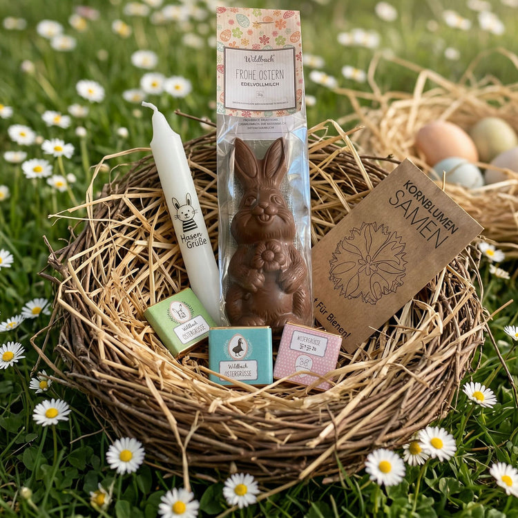 Kleines Osternest für Kunden mit Osterkerze, Schokohase, Schokotäfelchen und Blumensamen. Auch ein perfektes Ostergeschenk für Mitarbeiter!